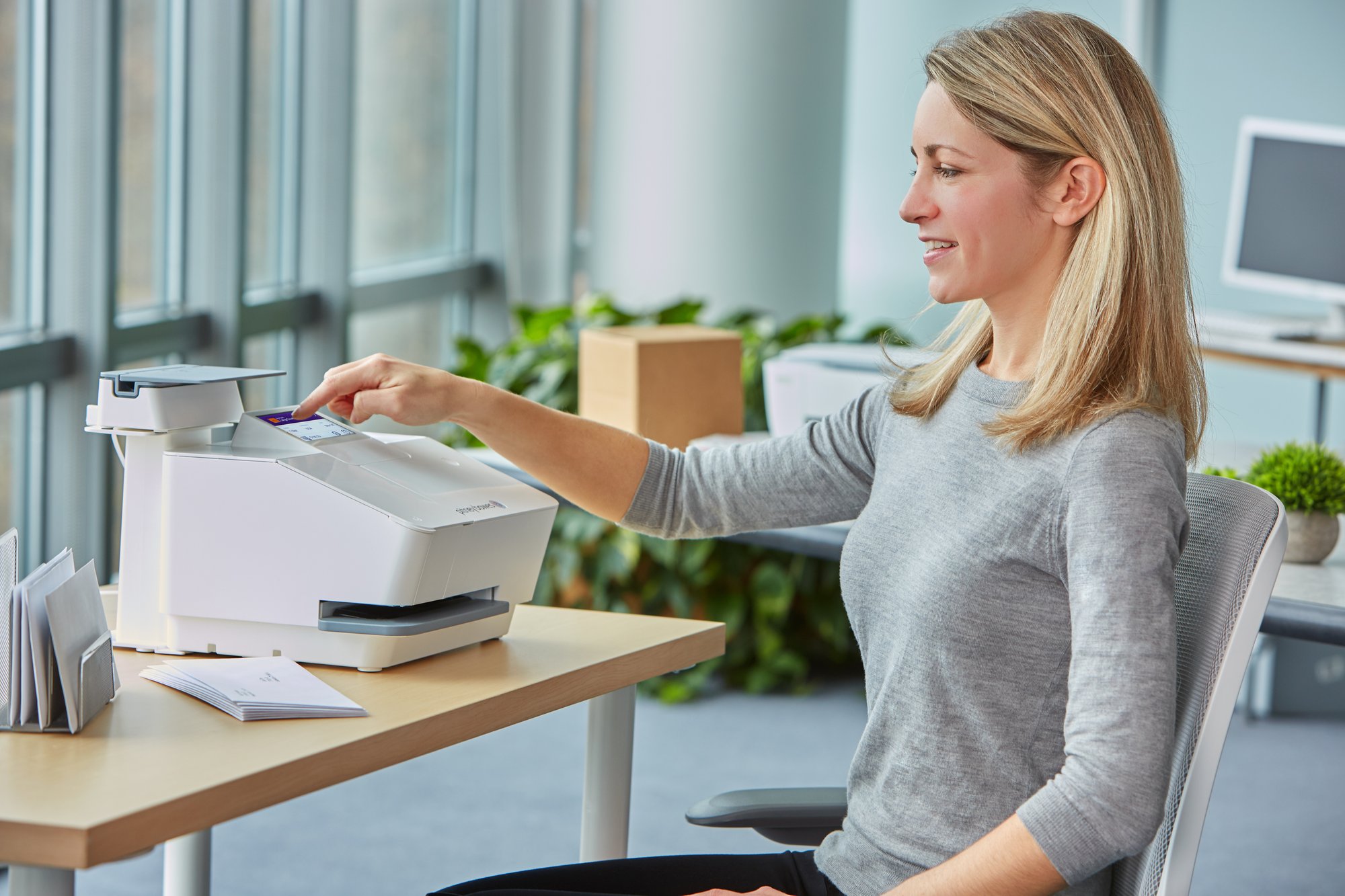 SendPro Mailstation - side angle - office env - interface selection - 20199056